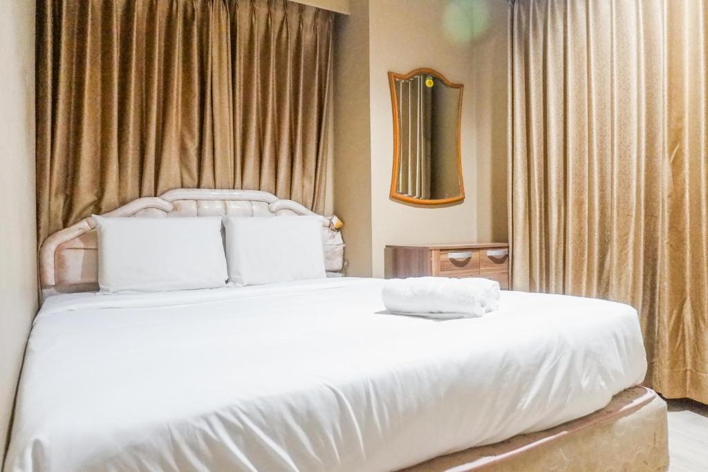 Suko Manunggal Apartment | Scenic 2BR Apartment at Taman Beverly By Travelio