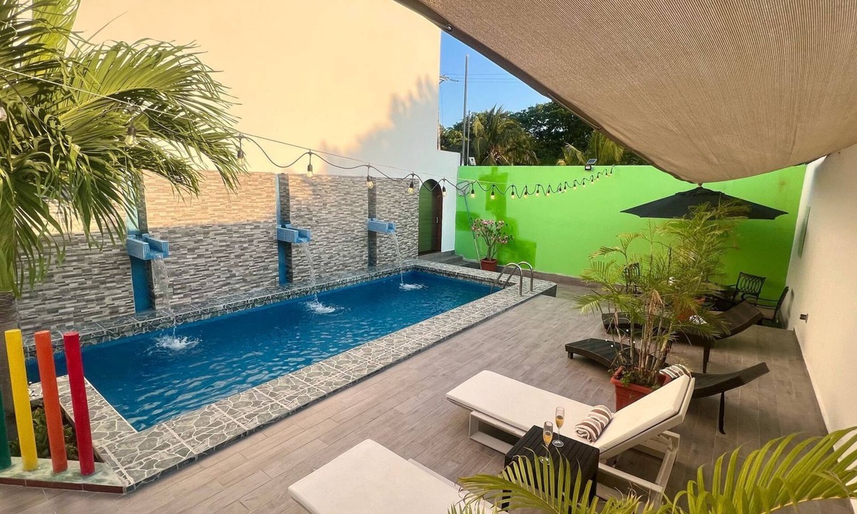 Puerto Juarez Apartment | SWEET HOME steps from the beach & ferry to Isla Mujeres. With Pool & rooftop