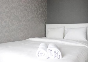 Pleasant and Homey 2BR Apartment at Tamansari La Grande By Travelio
