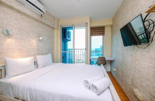 Kayu Putih Apartment | Minimalist Studio with Great City View at Tifolia Apartment By Travelio