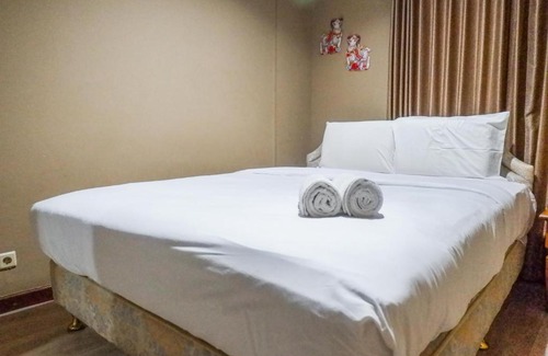 Suko Manunggal Apartment | Scenic 2BR Apartment at Taman Beverly By Travelio