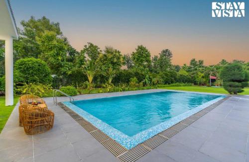 Gurugram Villa | StayVista at Imperial Isle 4BHK Luxury Villa with FREE BF, Outdoor Pool in Sohna Delhi