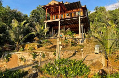 Ham Ninh Ski Chalet | Amazing sunrise over wooden house at the East