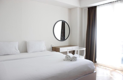 Arjuna Apartment | Artistic 3BR Apartment at Landmark Residence By Travelio