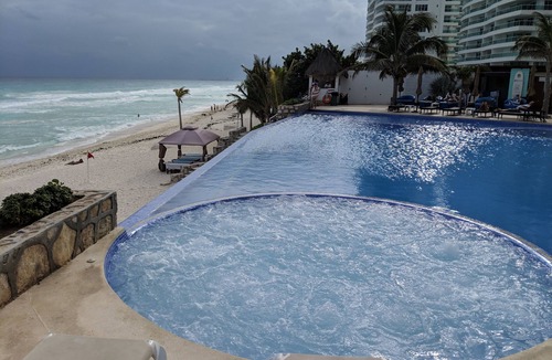 Punta Cancun Condo | Beachfront resort in best location, walk to best clubs and restaurants