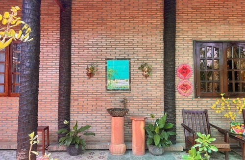 Long Ho House | CocoHome builted from 4000 coconut trunks -certificated as Vietnam Coconut House