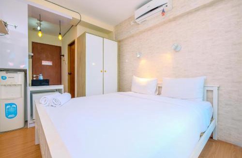 Kayu Putih Apartment | Minimalist Studio with Great City View at Tifolia Apartment By Travelio