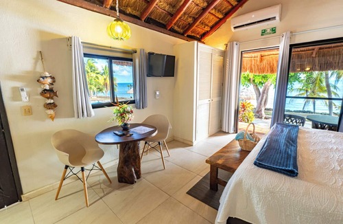 Isla Mujeres Cottage | Peaceful cottage on the beach,heated pool, tropical gardens and sunsets