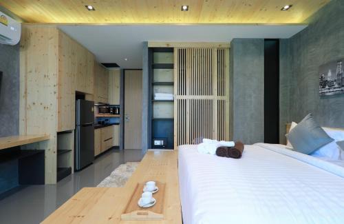 Nai Harn Apartment | Relife Windy by Holy Cow, studio with podium
