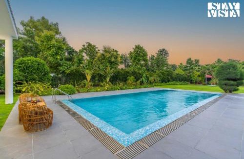 Gurugram Villa | StayVista at Imperial Isle 4BHK Luxury Villa with FREE BF, Outdoor Pool in Sohna Delhi