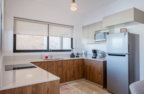 Telchac Puerto Apartment | Stunning oceanfront retreat with a pool and great views, perfect for families