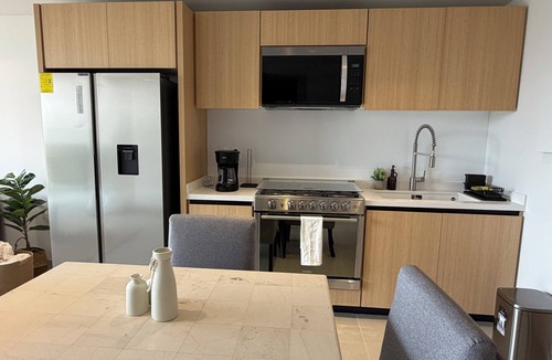 Del Carmen Apartment | Stylish 2BR/2BA apartment in Vivant Mitikah with luxury finishes and top amenities: pool, gym, business center & more. Located inside Mitikah Mall with shops, restaurants, and Walmart downstairs—everything you need in one place. 24/7 security.