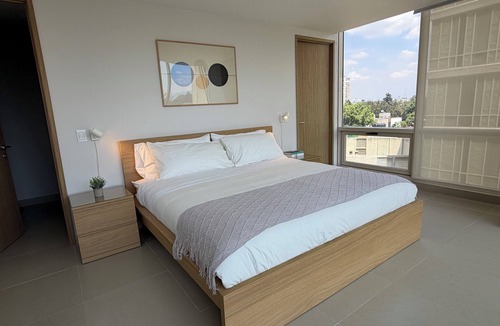 Del Carmen Apartment | Stylish 2BR/2BA apartment in Vivant Mitikah with luxury finishes and top amenities: pool, gym, business center & more. Located inside Mitikah Mall with shops, restaurants, and Walmart downstairs—everything you need in one place. 24/7 security.
