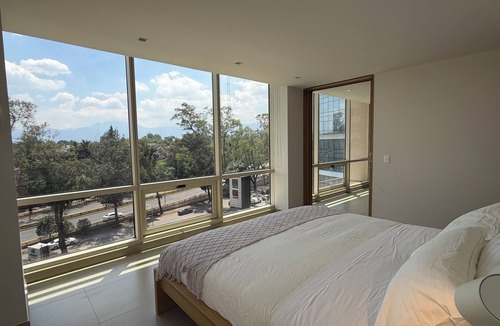Del Carmen Apartment | Stylish 2BR/2BA apartment in Vivant Mitikah with luxury finishes and top amenities: pool, gym, business center & more. Located inside Mitikah Mall with shops, restaurants, and Walmart downstairs—everything you need in one place. 24/7 security.