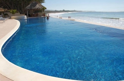 Emiliano Zapata Condo | Truly Right on the Beach! Lovely 3 bedroom 5th floor Punta Mita condo. Surfing!