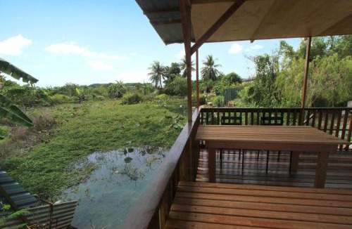 Ipoh House | Tung's Tropika - With a Wooden Hut by a Lake