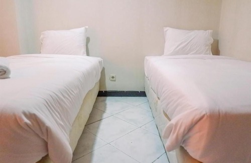 Suko Manunggal Apartment | Very Spacious 3BR High Floor Taman Beverly Apartment By Travelio