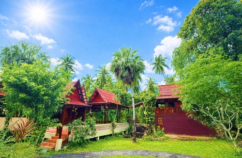 Baan Tai Villa | Welcome Villa Garden a peaceful and spacious home surrounded by lush greenery.