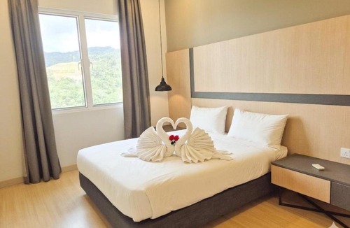 Genting Highlands Hotel | Windmill upon hills by gold place Genting highlands