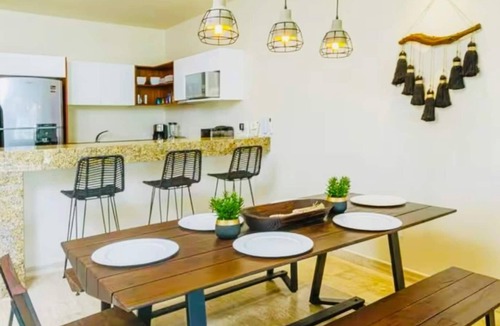Zama Apartment | Your Tulum escape awaits. Relax in a private rooftop pool, enjoy tropical views from 3 balconies, 3 bedrooms with smart TV's, and stay minutes from beaches, cenotes, dining, and nightlife.