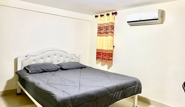 A spacious King bedroom with Air Condition