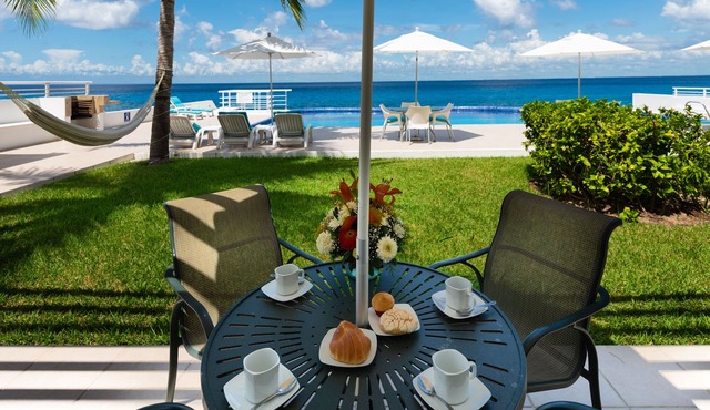 Condo 101, Swimming pool level oceanfront condo, Pristine grounds and pool!