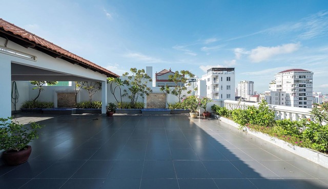 Cozy 1BR condo with hardwood floors and rooftop sunset garden in Phnom Penh