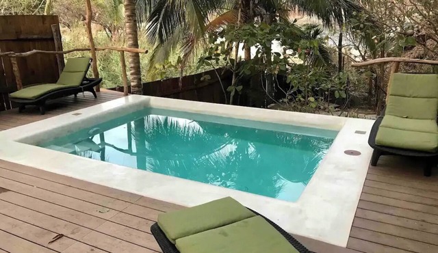 Great room with deck pool in front of perfect bay