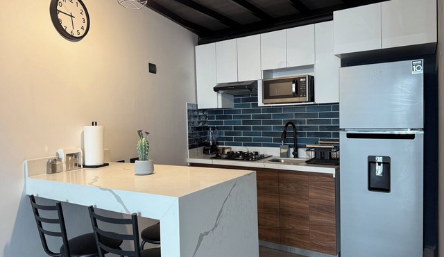 Modern double-height loft new and equipped with its own parking lot