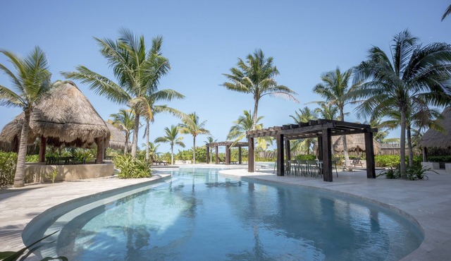 Oceanfront retreat with private balcony, outdoor pool, and stunning views in Telchac-Puerto