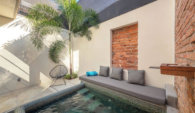 Stunning loft with industrial design and steps from the beach and nightlife.​