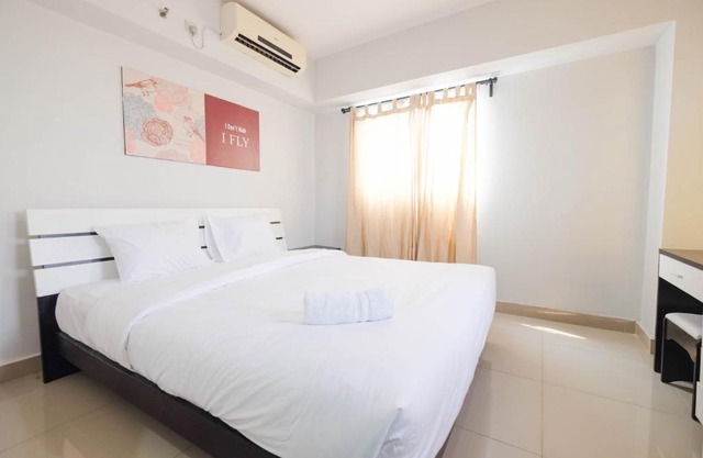 Contemporary 2BR at The Wave Apartment By Travelio
